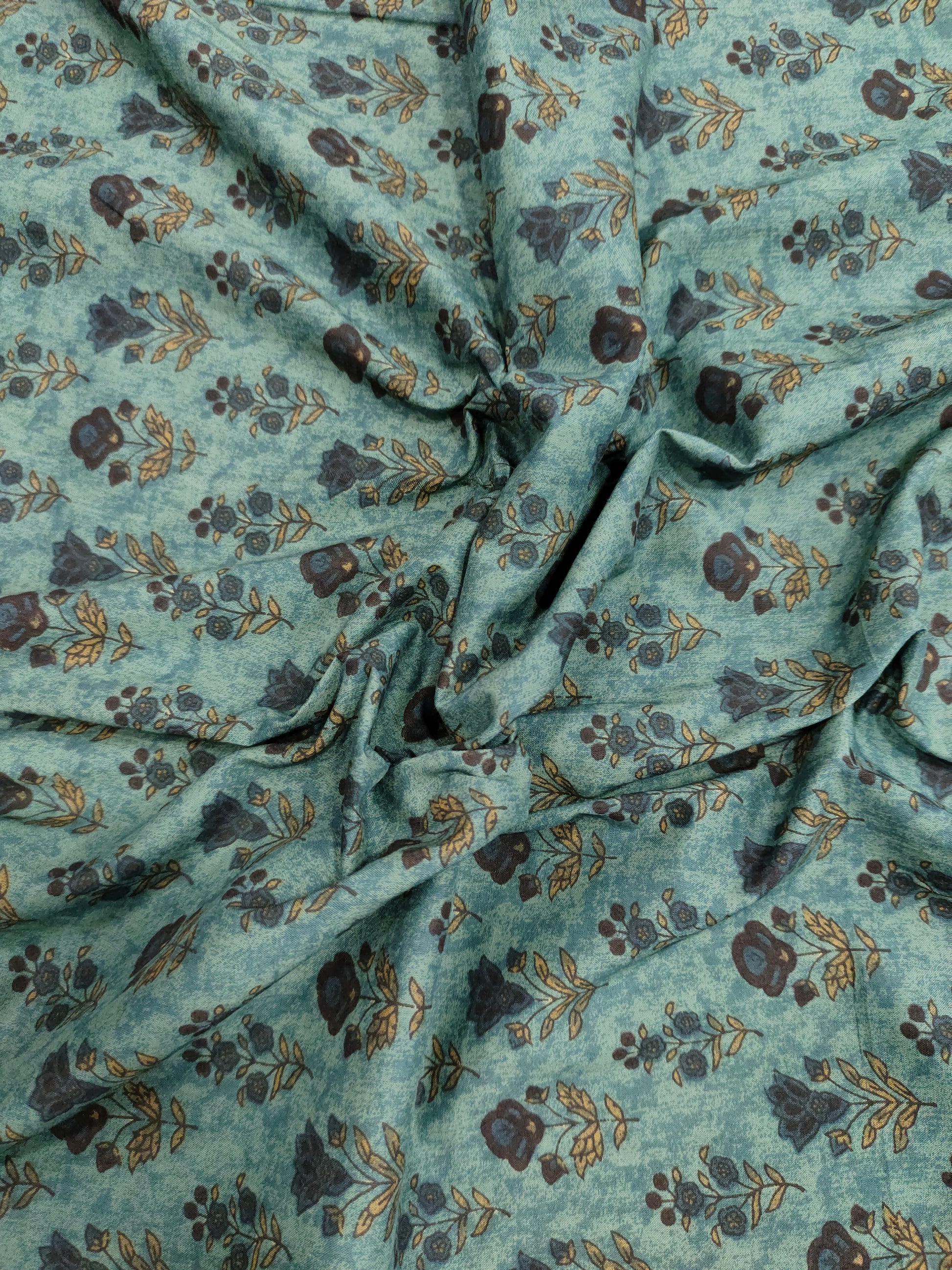 Cotton 60s bagh print butti on peacock green color.
