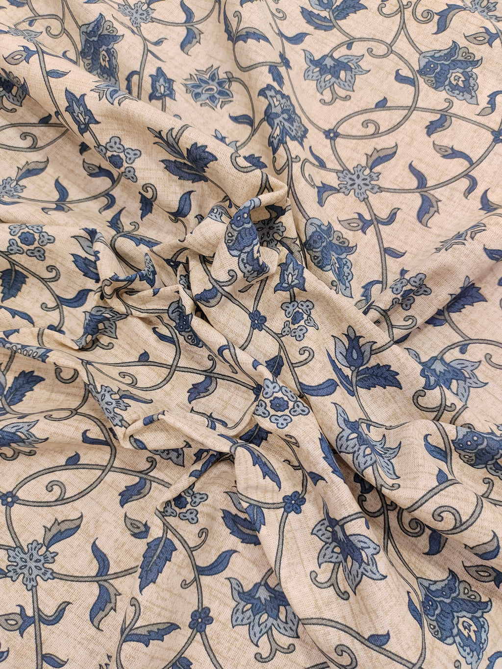 Cotton flex print on beige fabric with blue color jaal print.