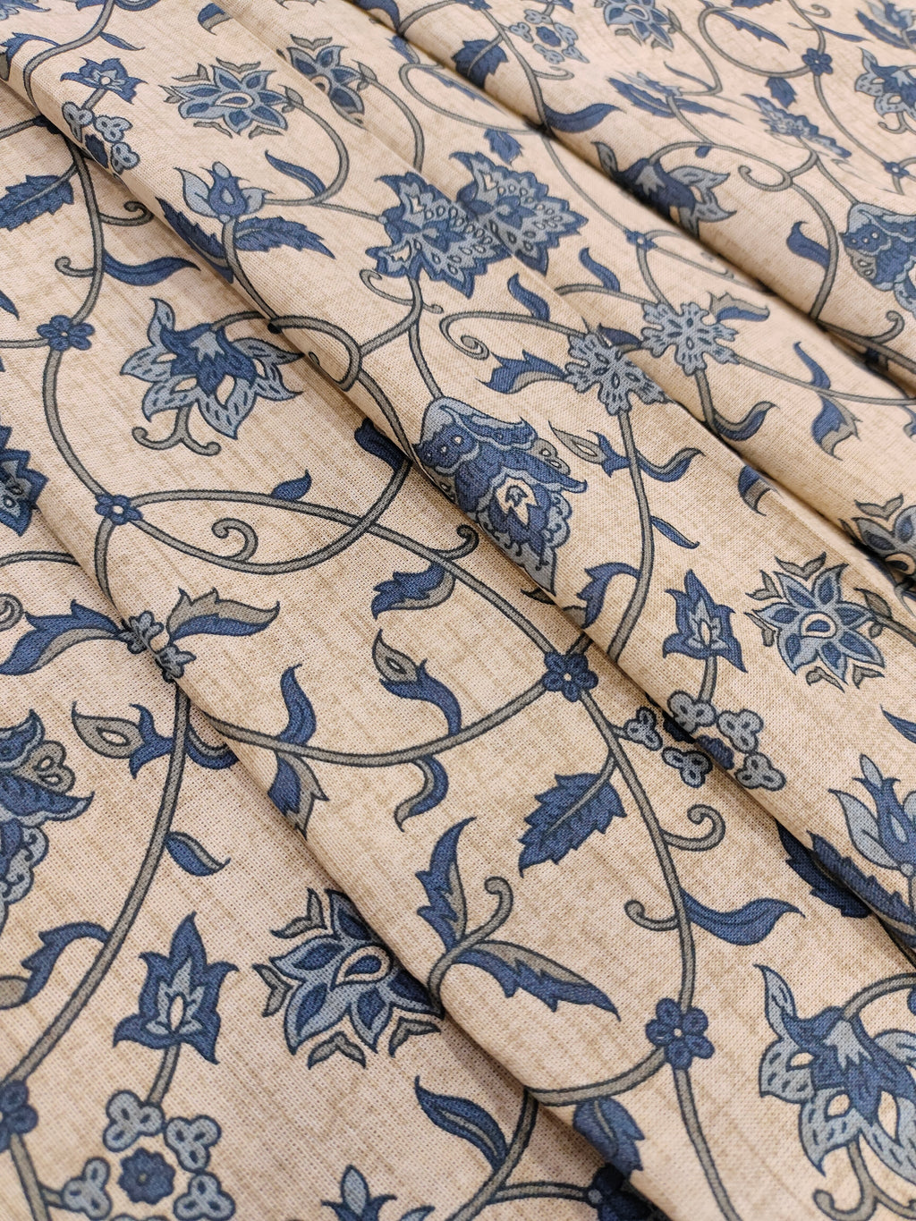 Cotton flex print on beige fabric with blue color jaal print.