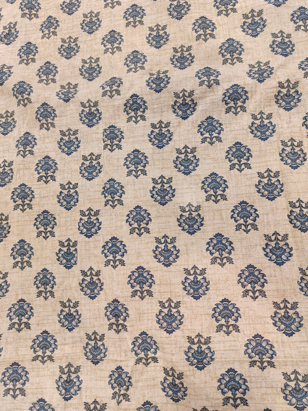 Beige flex cotton fabric with blue pointed flowers.