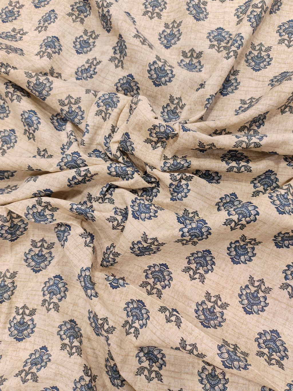 Beige flex cotton fabric with blue pointed flowers.