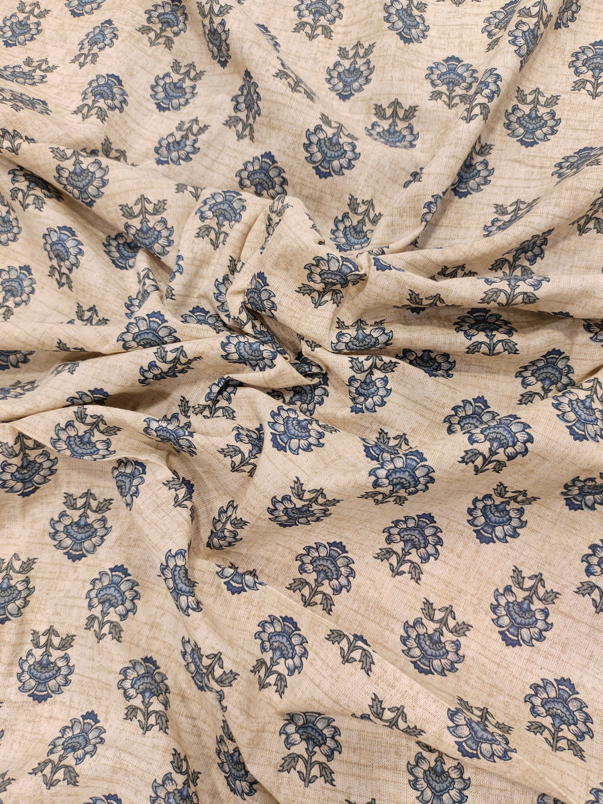 Beige flex cotton fabric with blue pointed flowers.