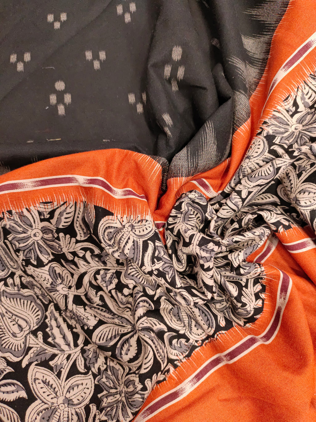 Black printed rust daman print on cotton fabric.