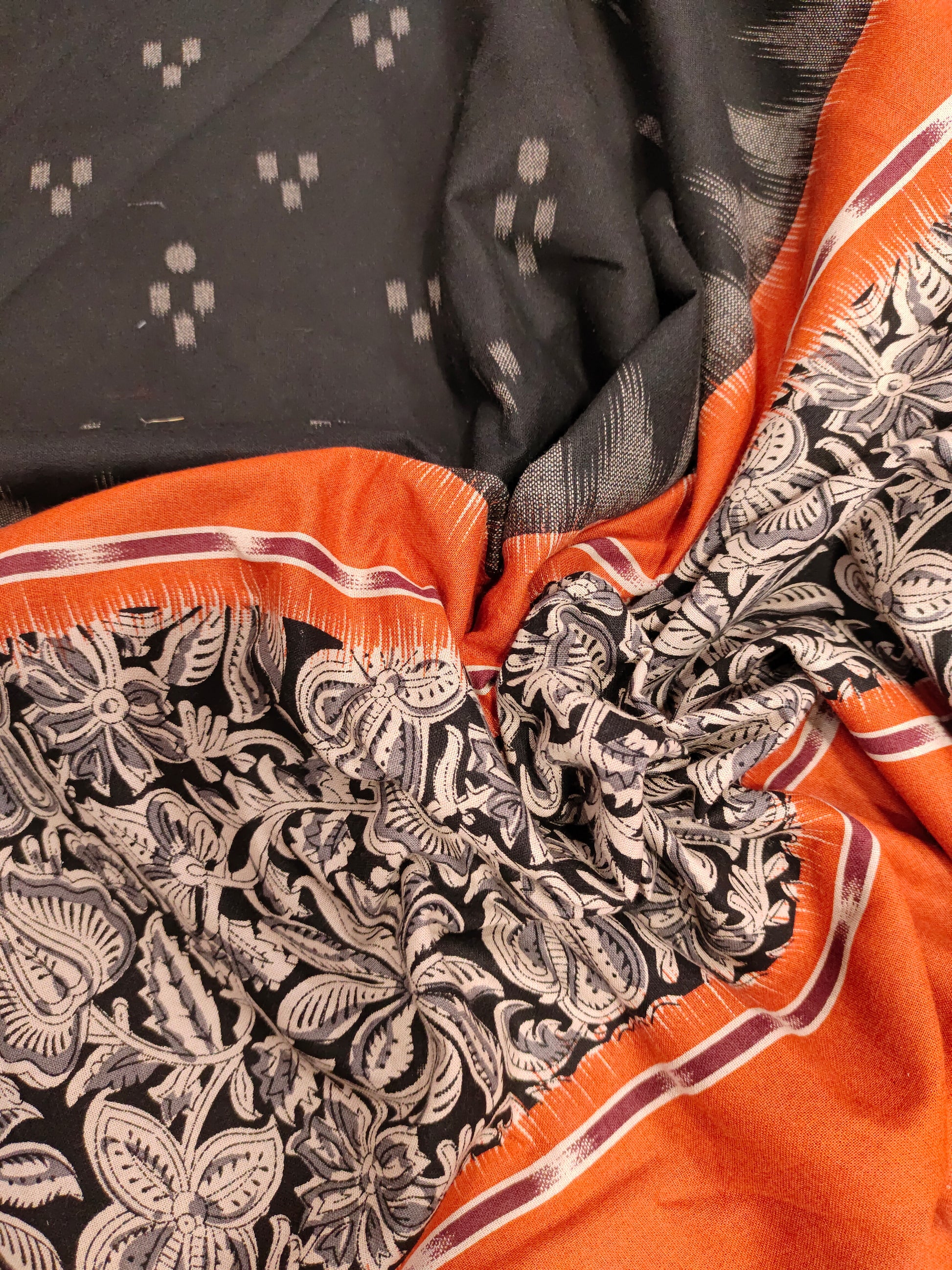 Black printed rust daman print on cotton fabric.