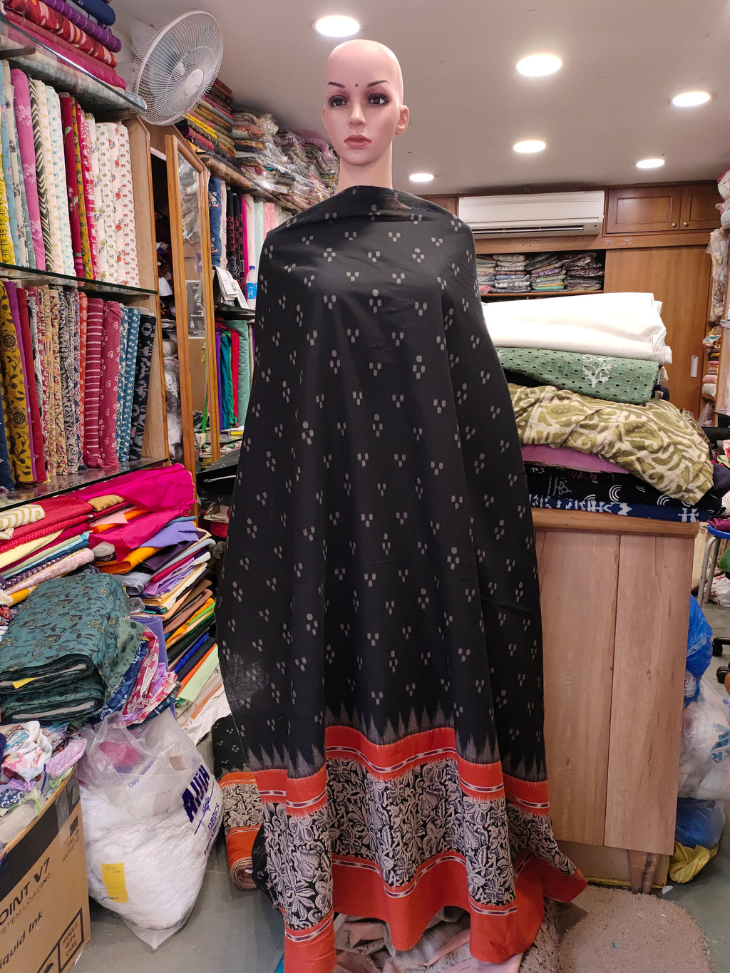 Black printed rust daman print on cotton fabric.