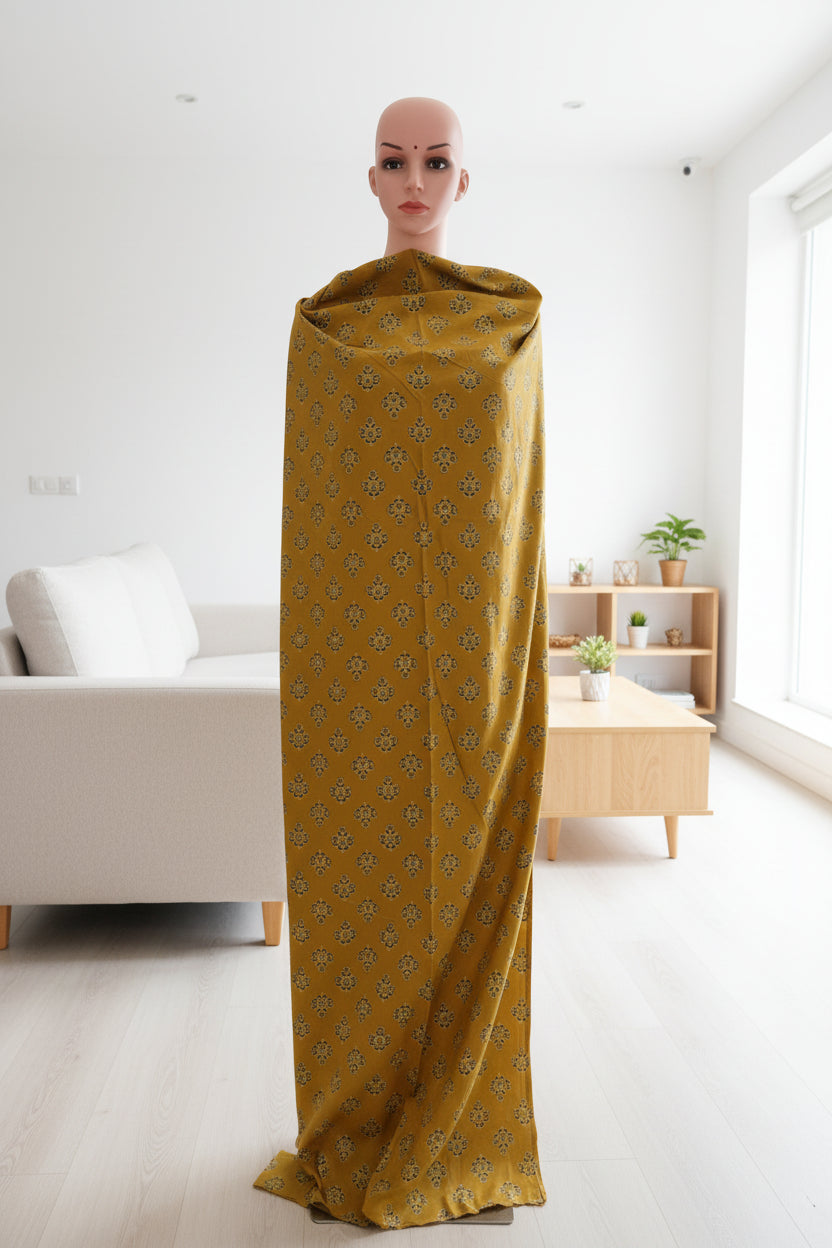 mustard cotton fabric with green black and beige butti.